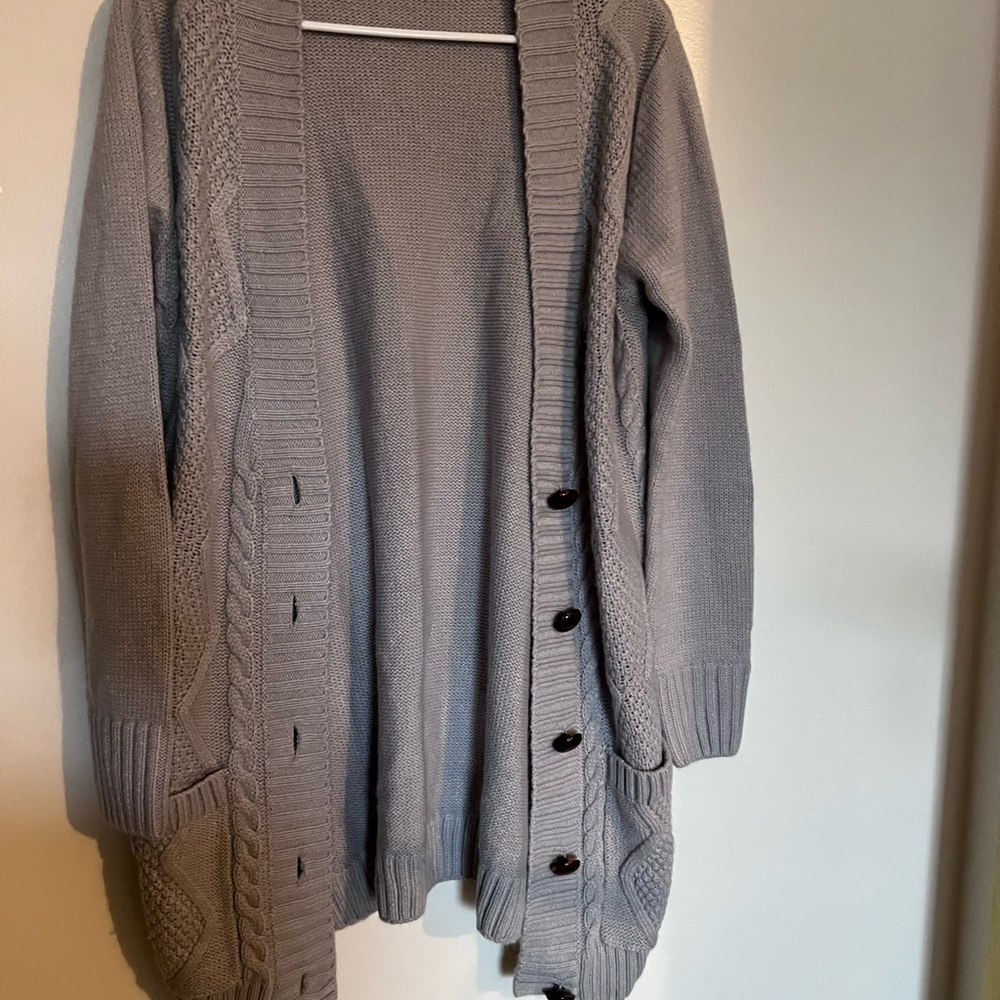 Grey cardigan sweater with big brown buttons